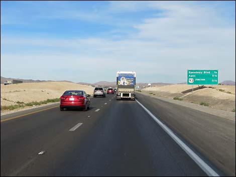 The interstate climbs steeply onto Mormon Mesa, a long stretch of flat country with the Mormon Mountains towering to the left and the high mountains of Gold Butte off to the right.