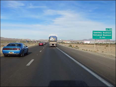 The interstate climbs steeply onto Mormon Mesa, a long stretch of flat country with the Mormon Mountains towering to the left and the high mountains of Gold Butte off to the right.